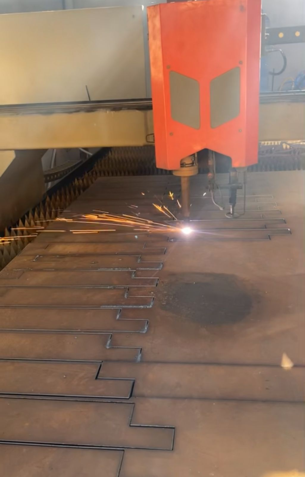 CNC plasma cutting sparks — El-Nesr shop floor